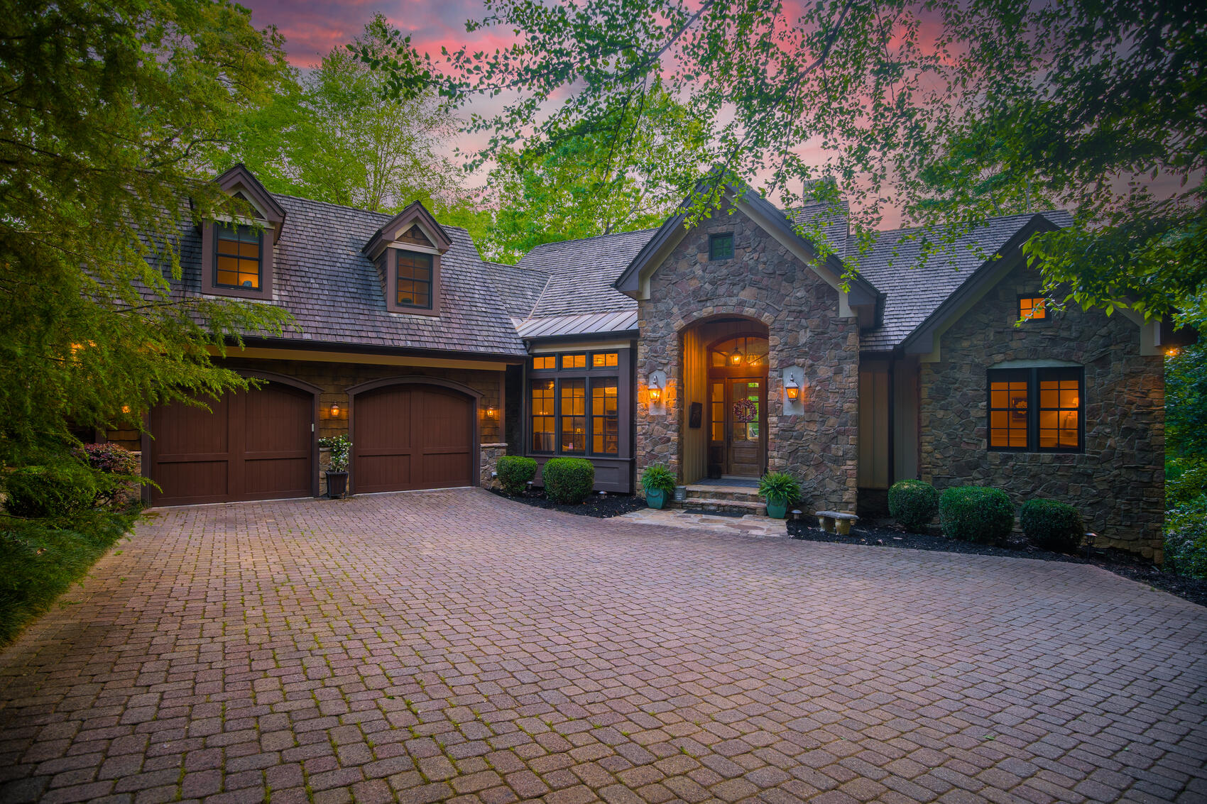 A stone residence at dusk at The Cliffs at Mountain Park